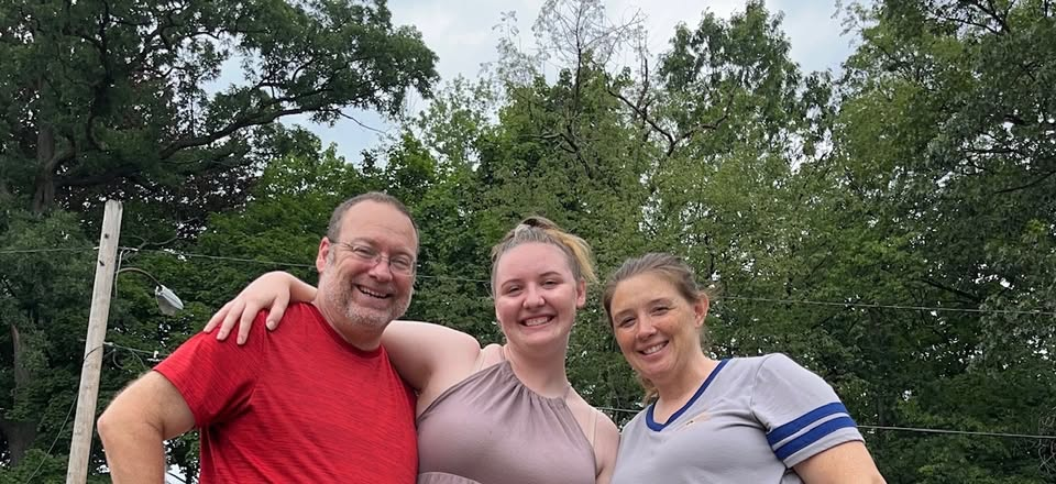 The Lucky13 Cleaning family smiling outdoors